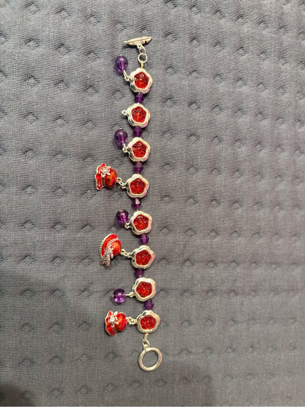 Red hat club novelty bracelet purple and red and silver